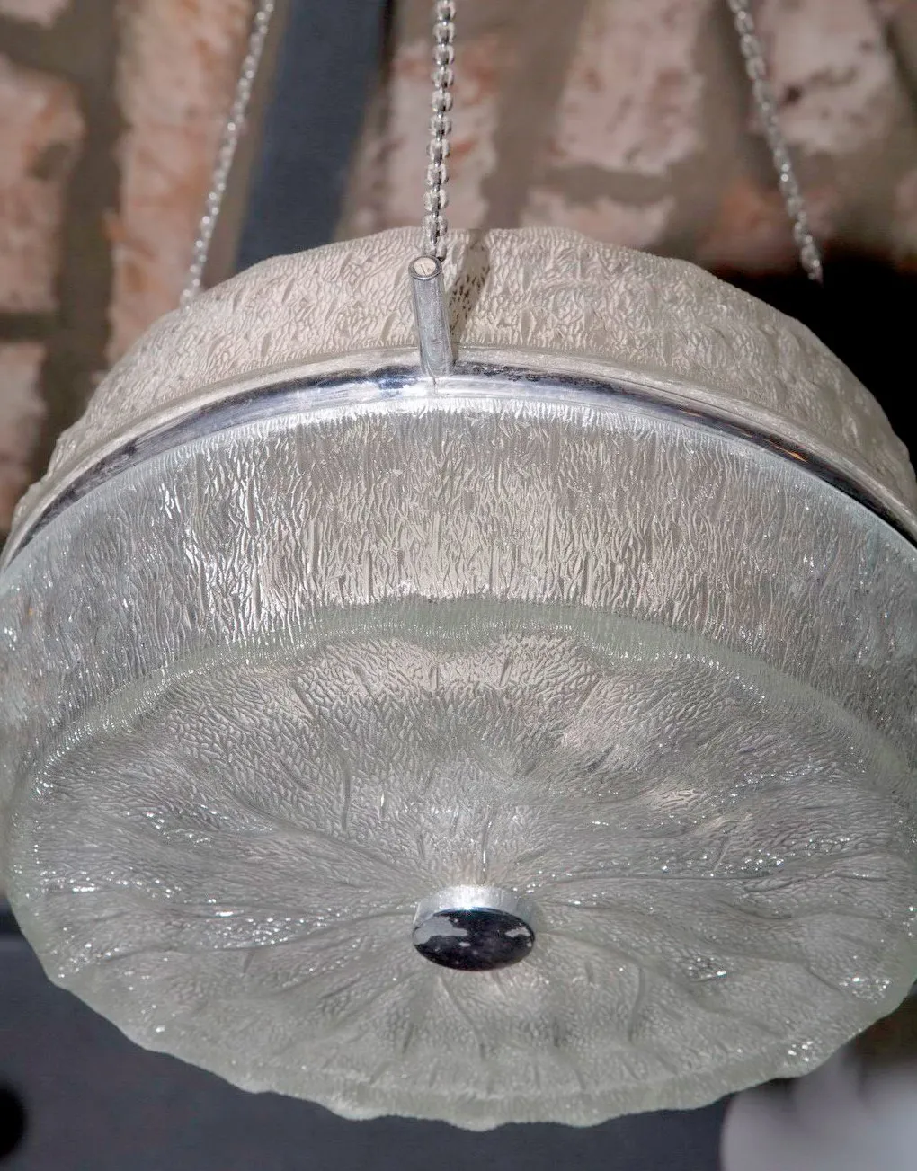 View of 2 antique hanging lamps in a cozy setting