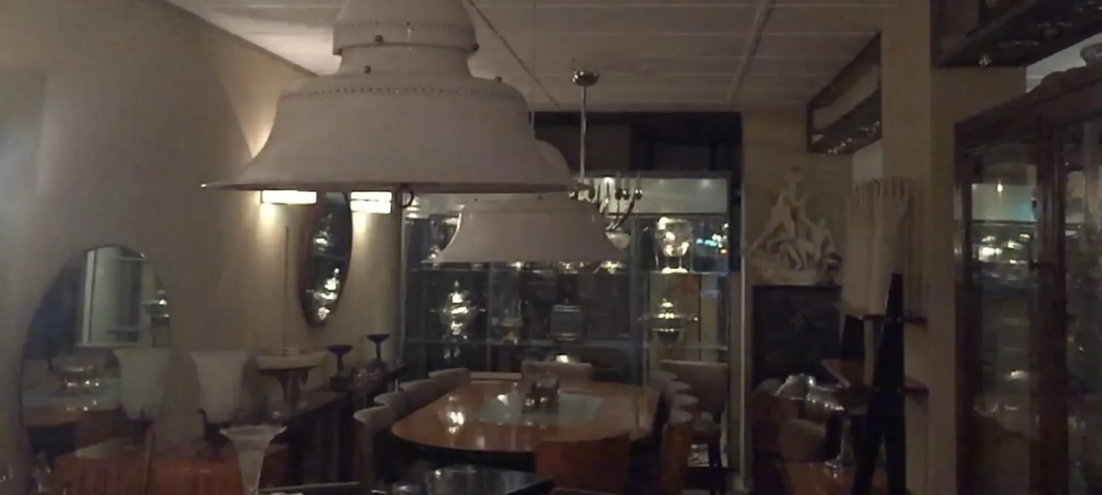 two antique hanging lamps in the dining area