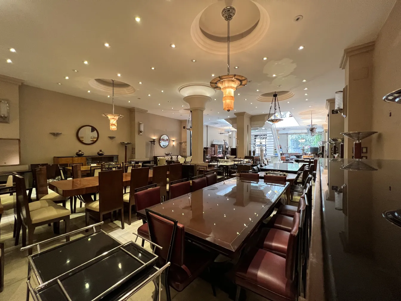 view of 2 antique hanging lamps in a dining room