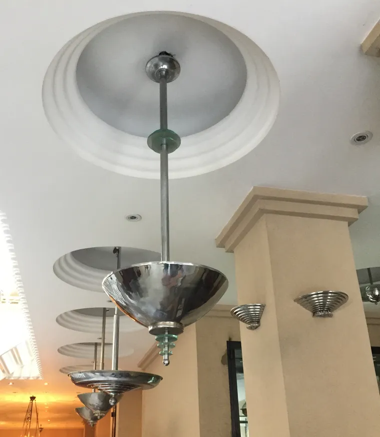 view of 2 antique hanging lamps in a modern setting