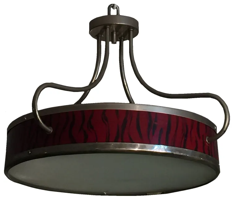 Antique hanging lamp with decorative red striped design.