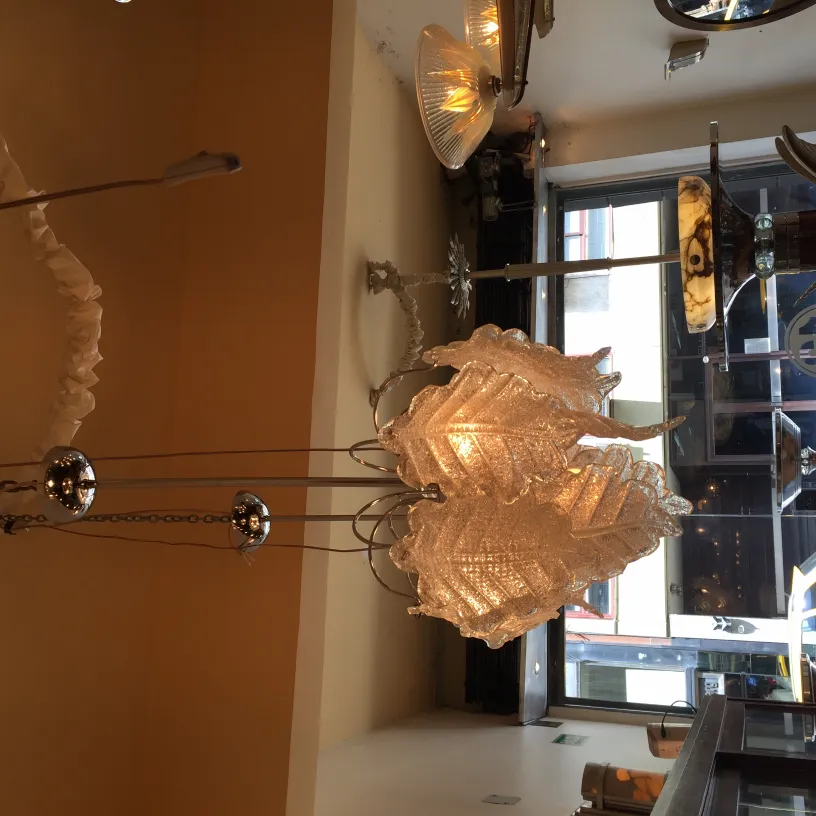 Two antique hanging lamps with intricate details in a cozy setting.