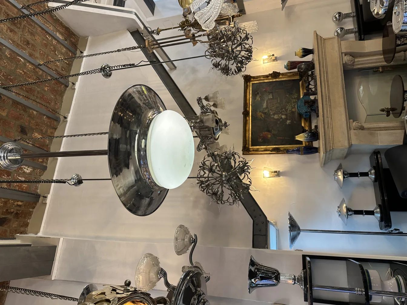 Two antique hanging lamps with elegant design, illuminating a classic environment.