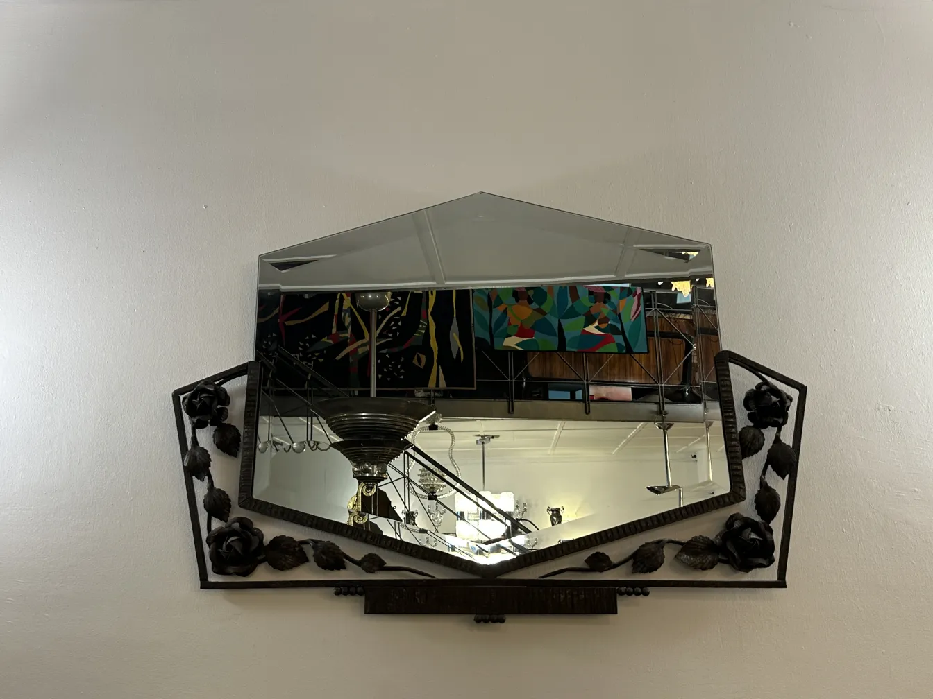 antique mirror with floral decoration in the frame