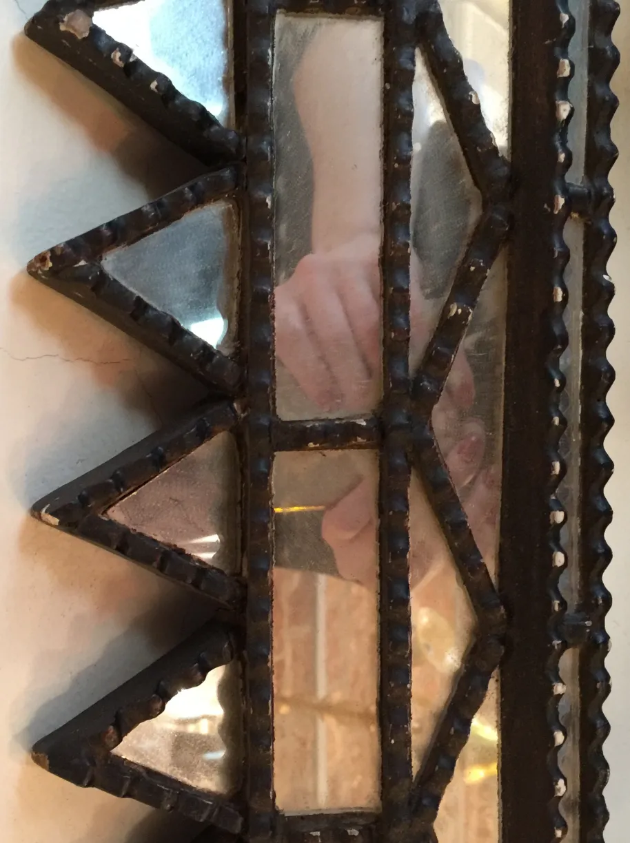 Decorative antique mirror with clear details and geometric shapes