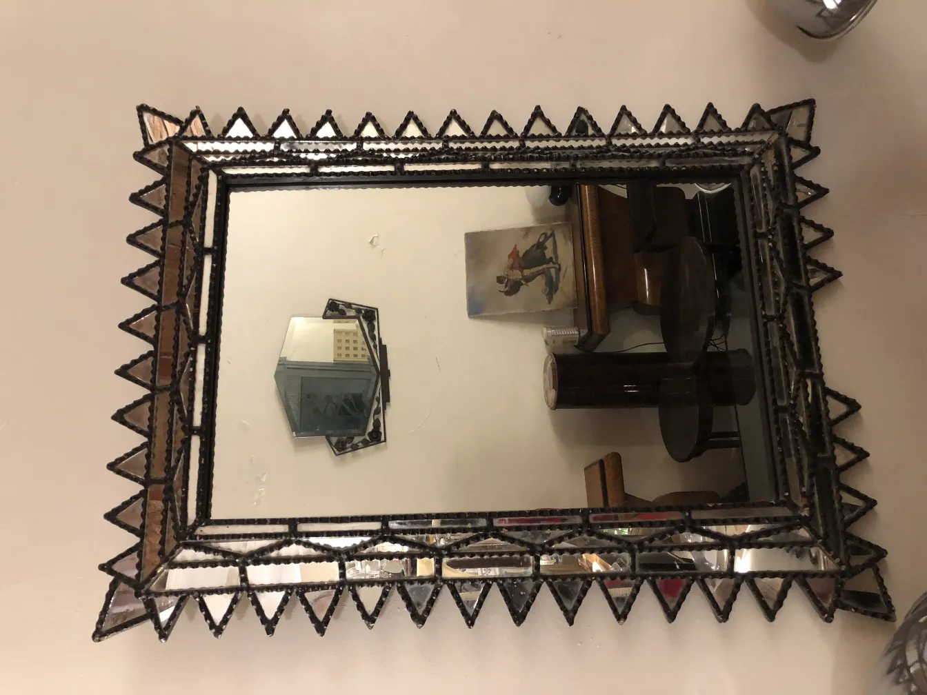 Antique mirror with decorative frame, geometric shape
