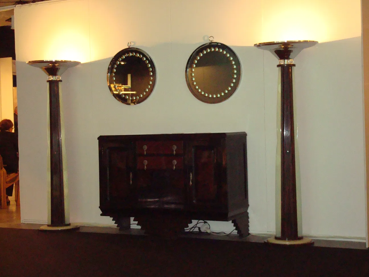 Round antique mirror on the wall with soft lighting