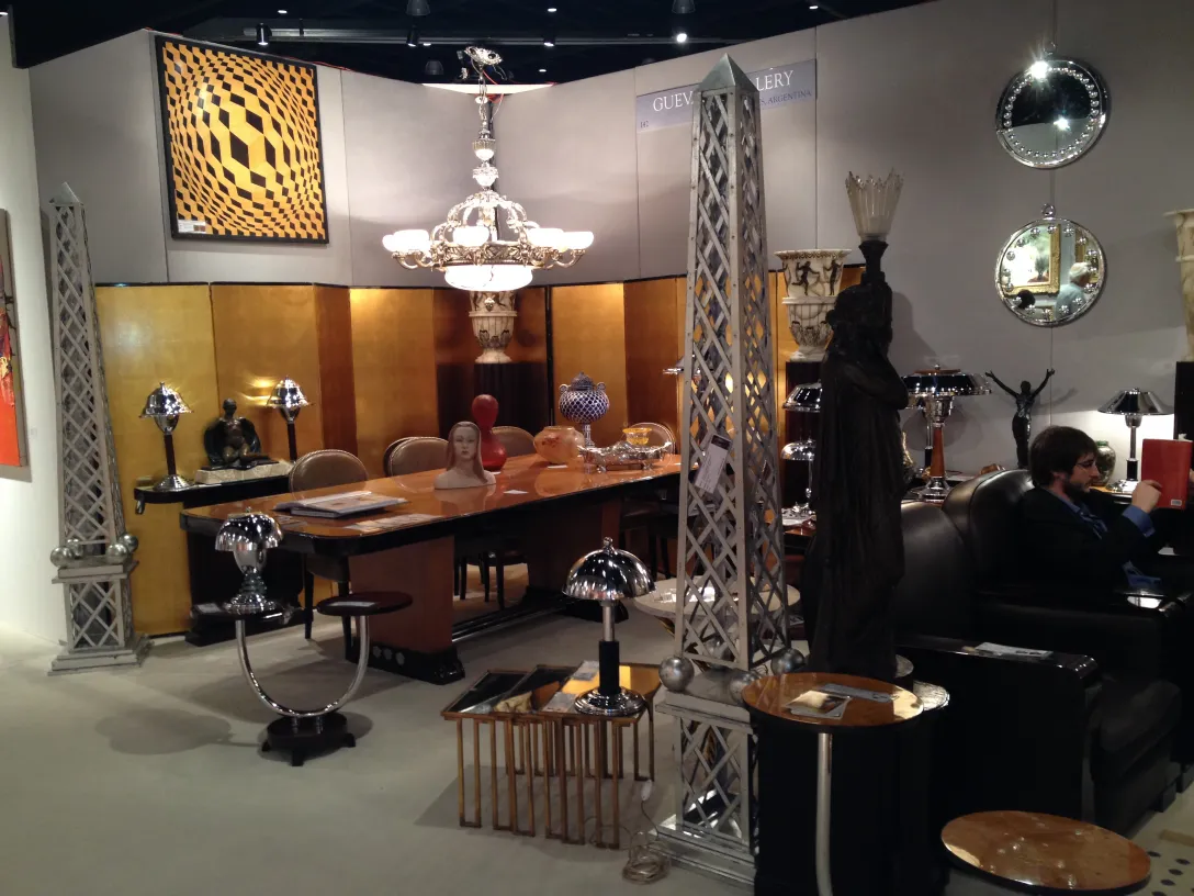 Antique mirror in an elegant setting with decorative furniture.