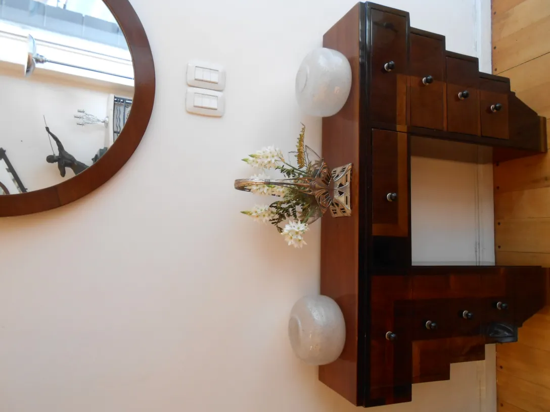 antique decorative round mirror with vase