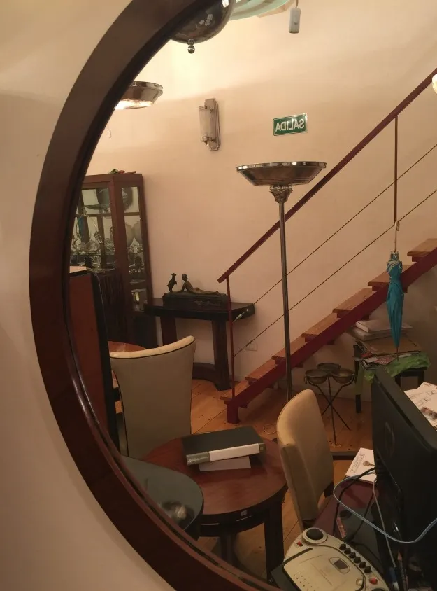 Round antique mirror in home decor with furniture