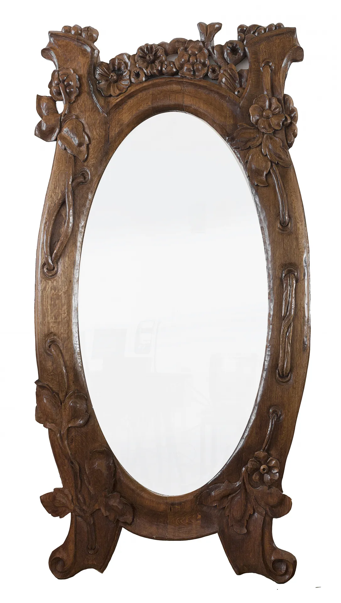 oval antique mirror adorned with flowers and detailed frame