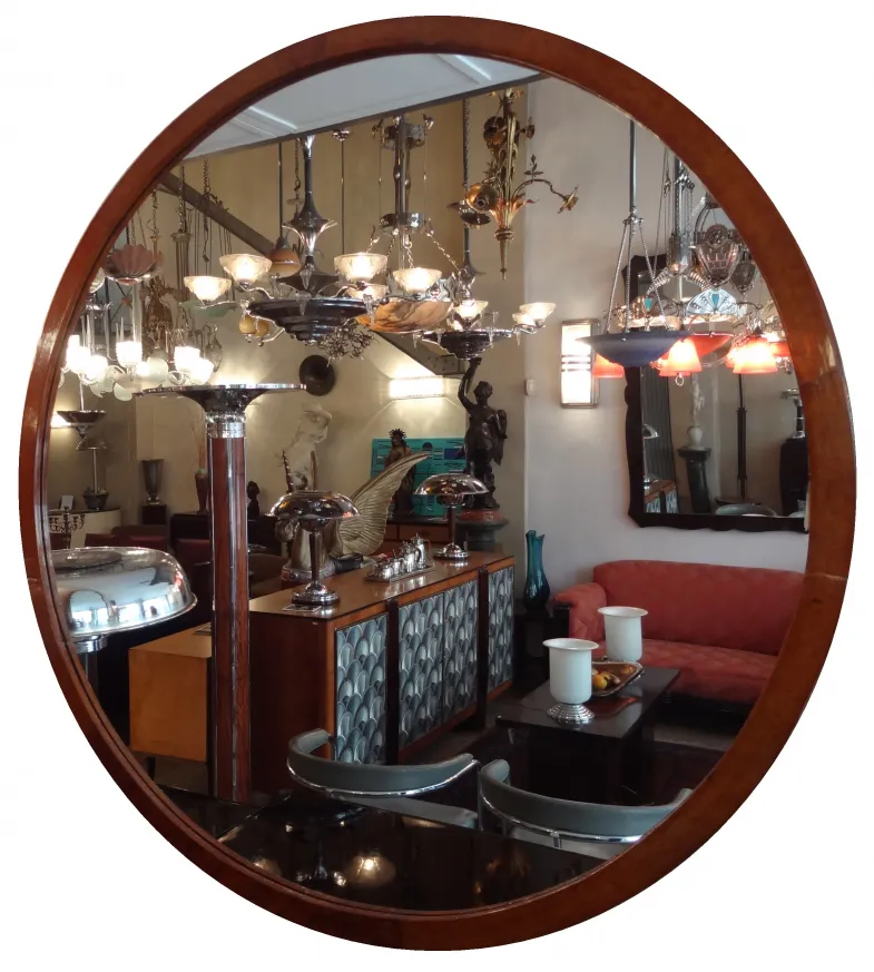 antique round mirror with illuminated background and decor