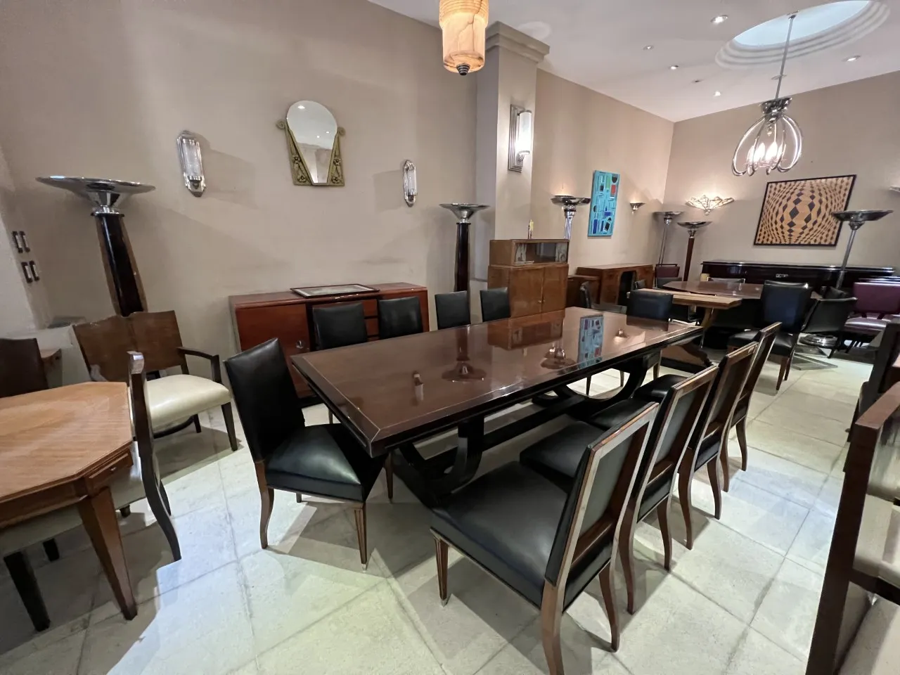 Antique decorative mirror in an elegant room with tables and chairs