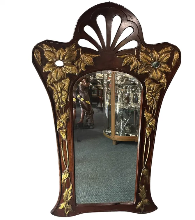 miroir ancien avec des fleurs dorées et un design élégant