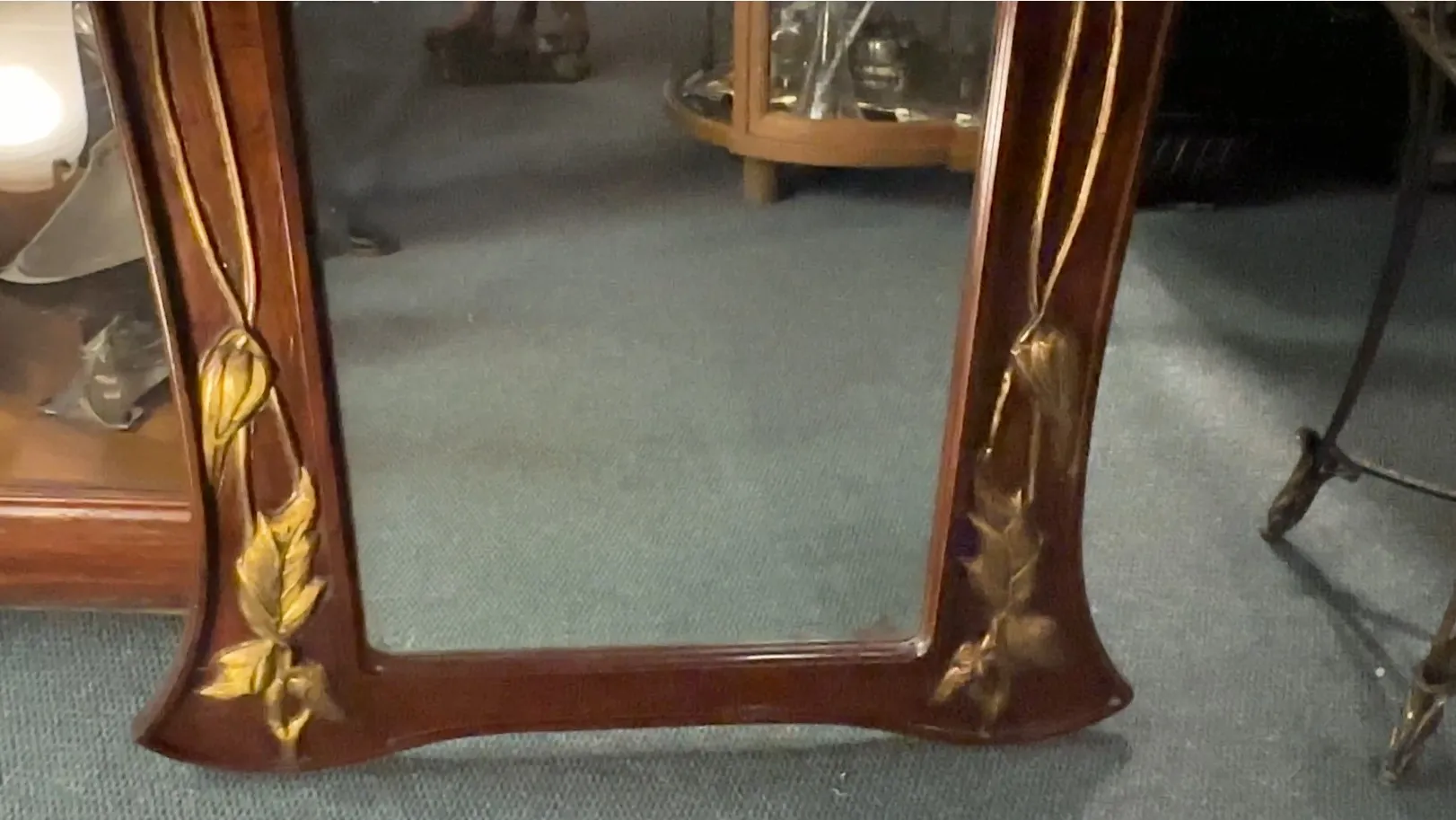 antique decorative mirror with detailed flowers on frame