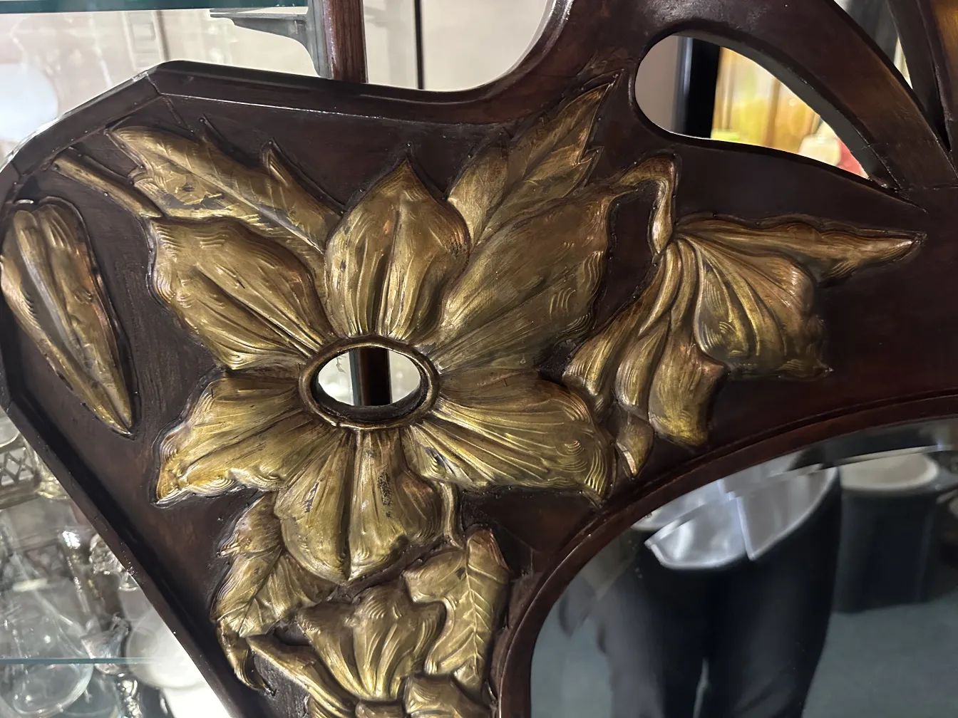 antique mirror featuring floral decorations