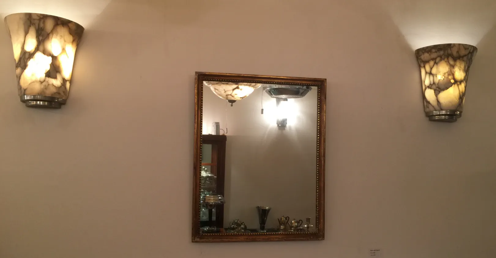 antique wall mirror with golden frame and light