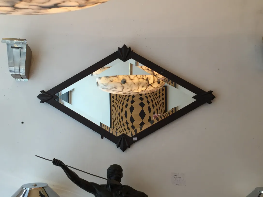 Antique diamond-shaped mirror with black details