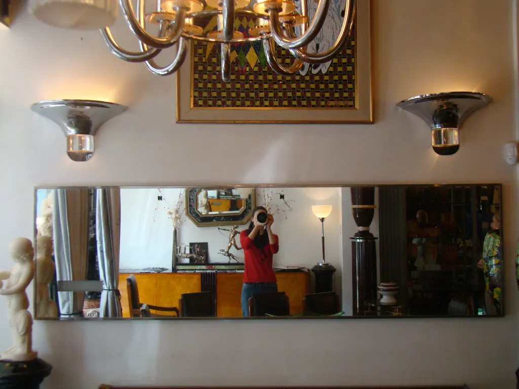 large antique wall mirror with decorations