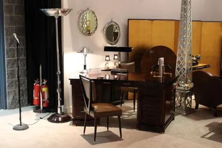 antique wall mirror in an elegant setting, alongside a lamp