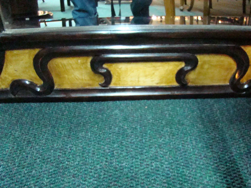 Antique mirror adorned with art nouveau design