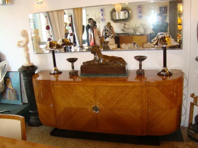 antique mirror in a retro room with lamps and sculptures