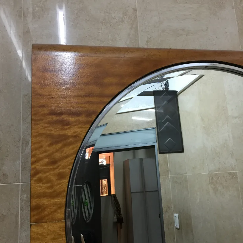 Antique round mirror with decorative frame