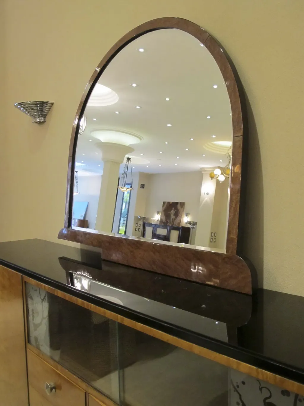 antique arch mirror reflecting soft lighting