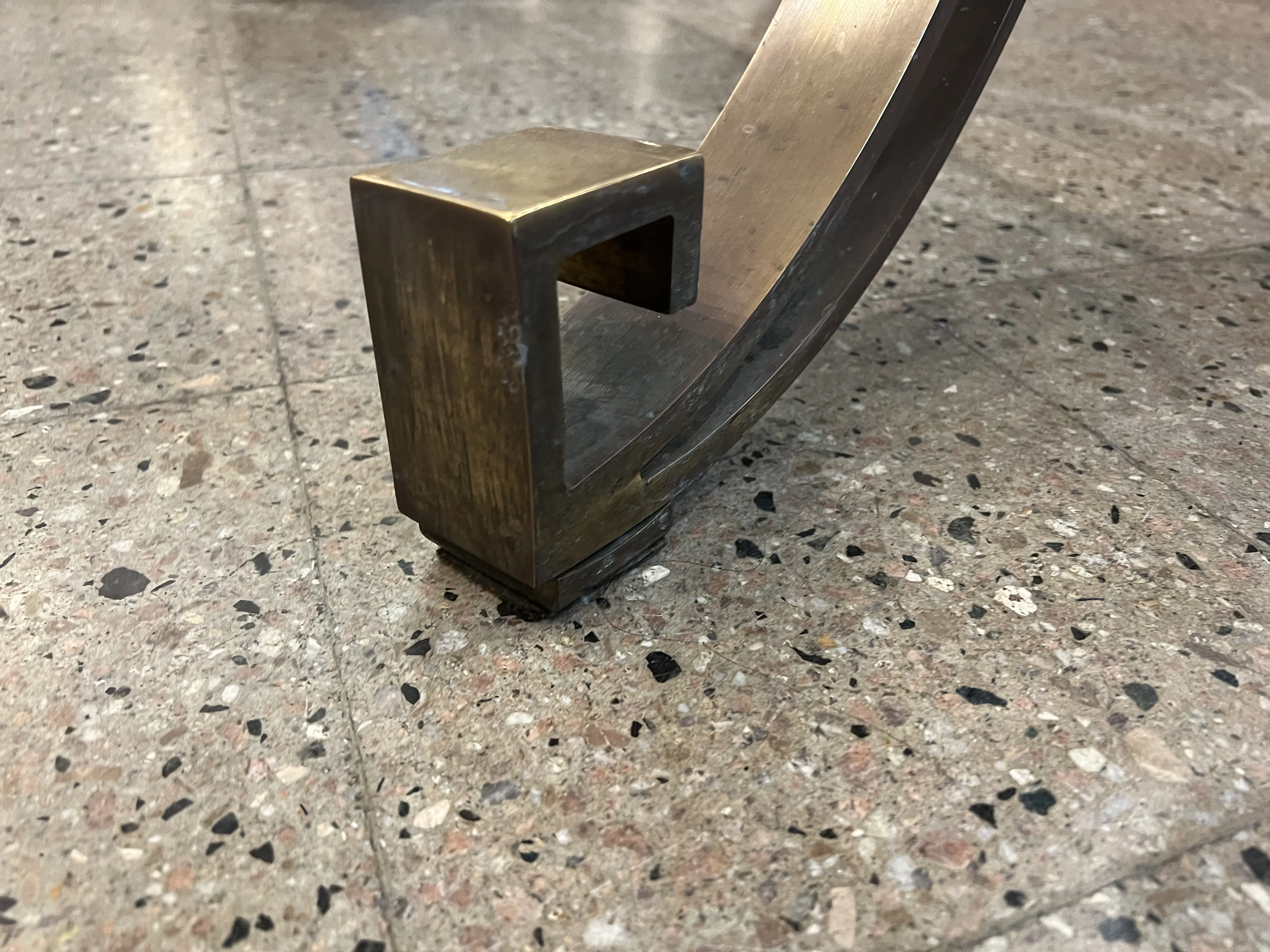 Detail of an antique dining table base, featuring an elegant design.