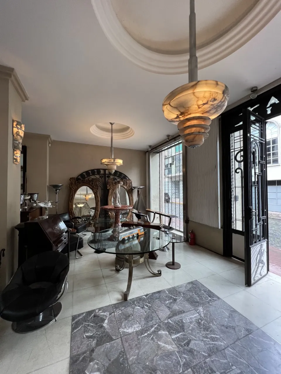 antique mirror with decorative design in the room