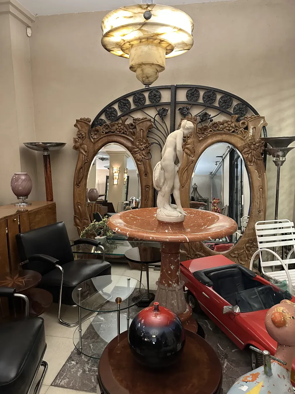 antique mirror with art nouveau details in a decorative setting