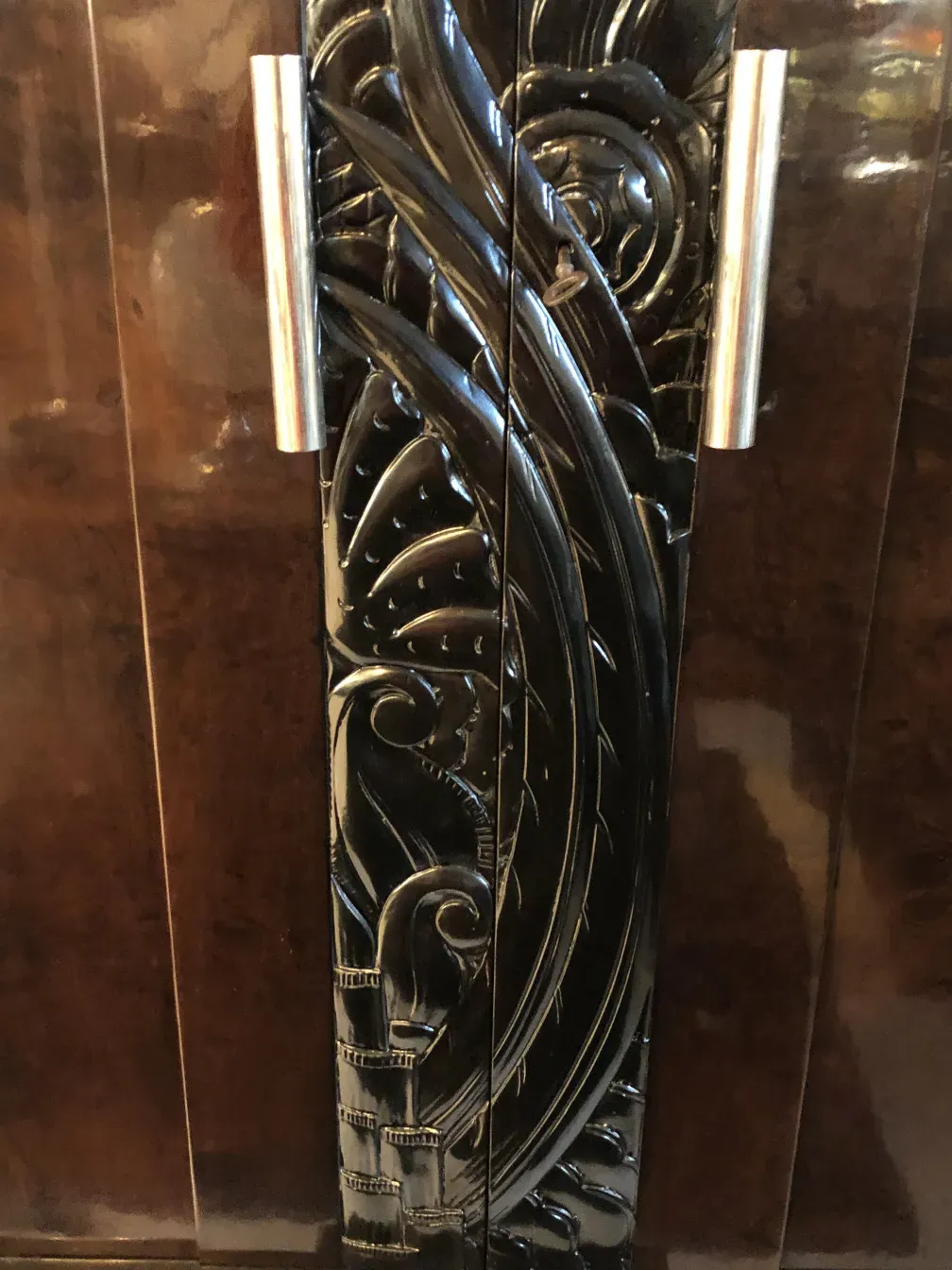 antique bookcase with intricate decorative details and classic ambiance