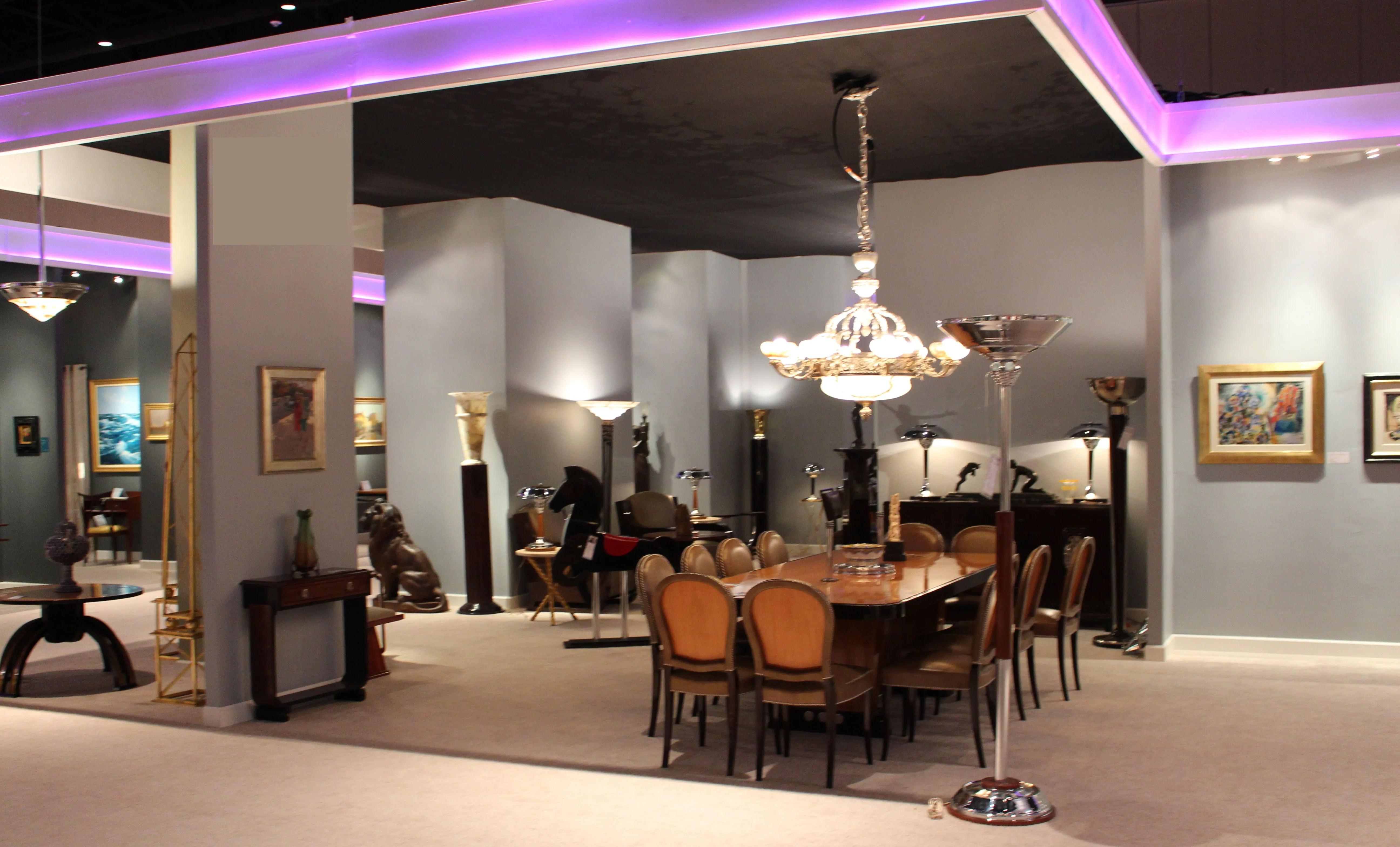 antique dining table for 10 to 12 people in an elegant setting with lamps and vintage décor