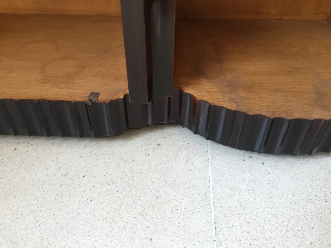 detail of an antique bookcase with curved design