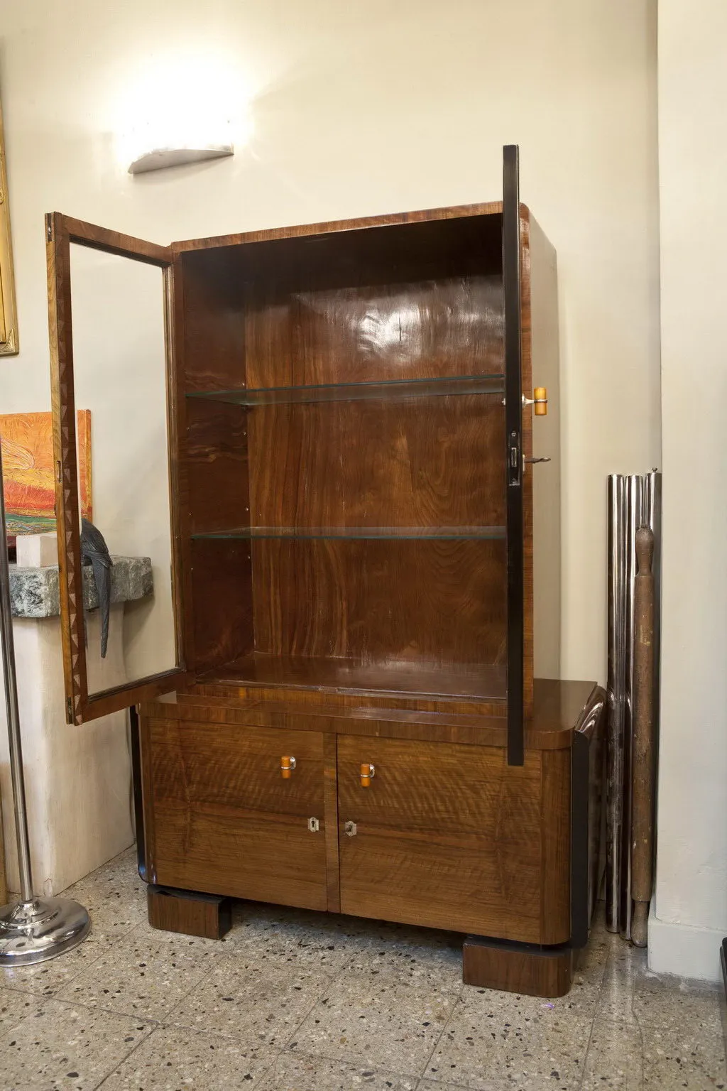 antique bookcase with open doors in an elegant setting