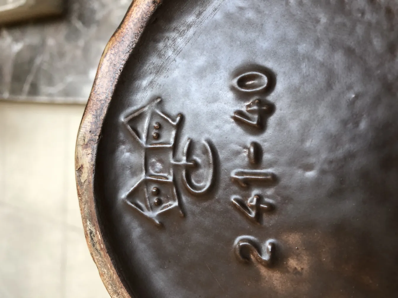 Antique decorative ceramic with engraved details at the base.