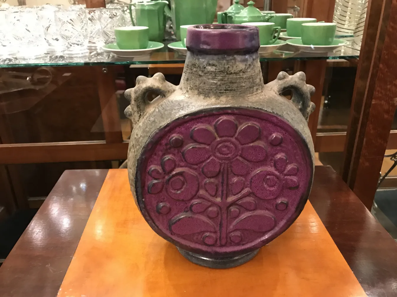 antique ceramic with purple decorations and floral patterns