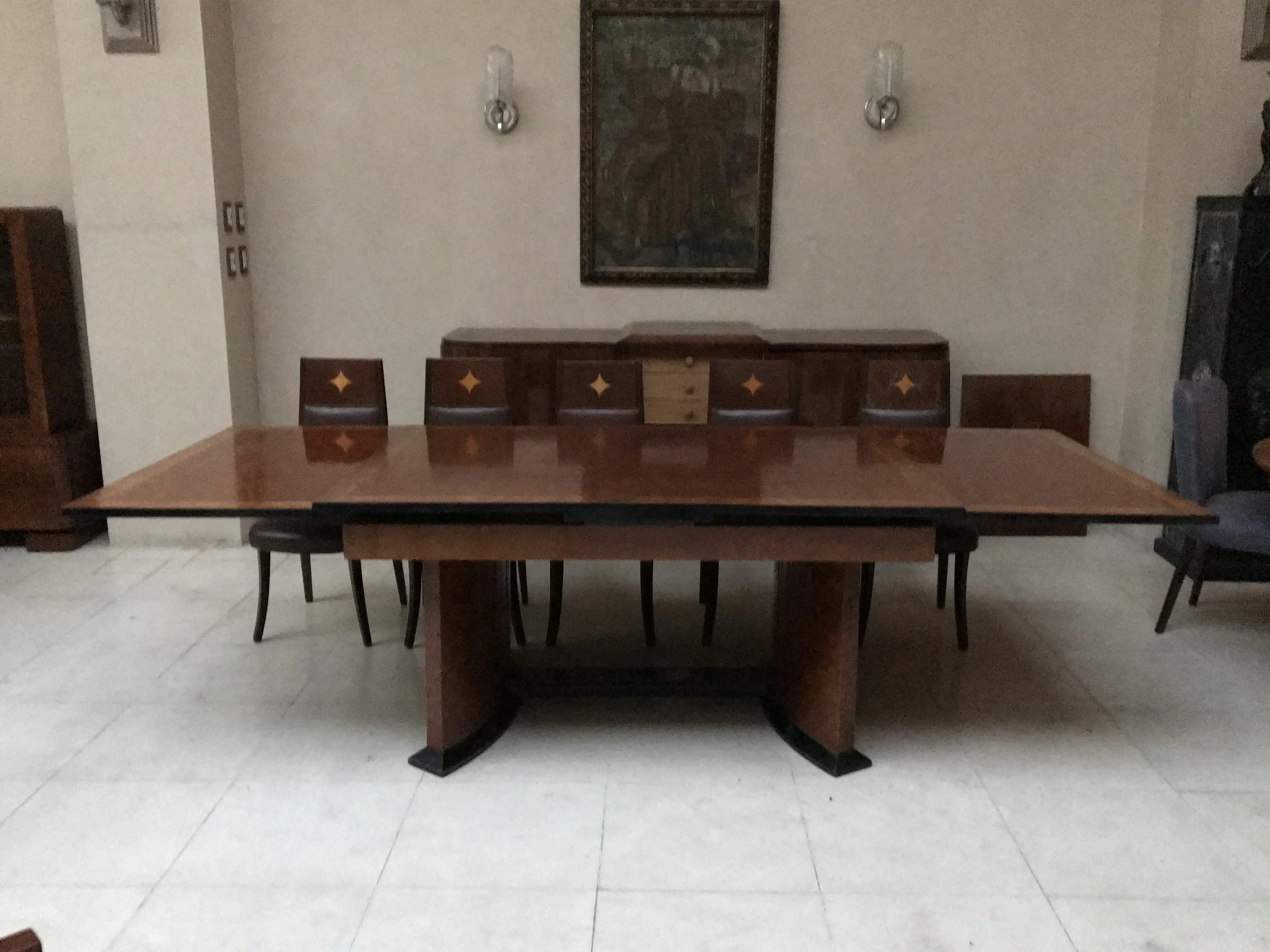 Antique dining table seating 12 in an elegant setting.