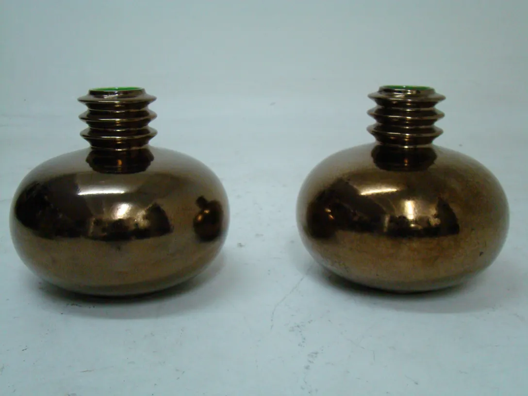 two antique ceramic vases with an oval shape and a shiny finish.