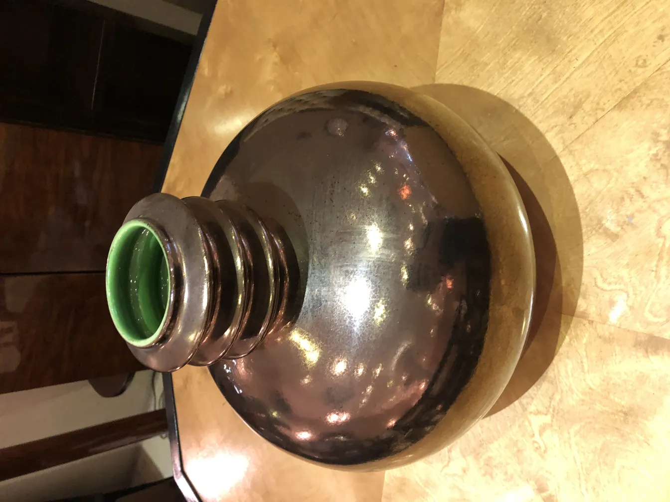 Antique bright ceramic with round base and green top