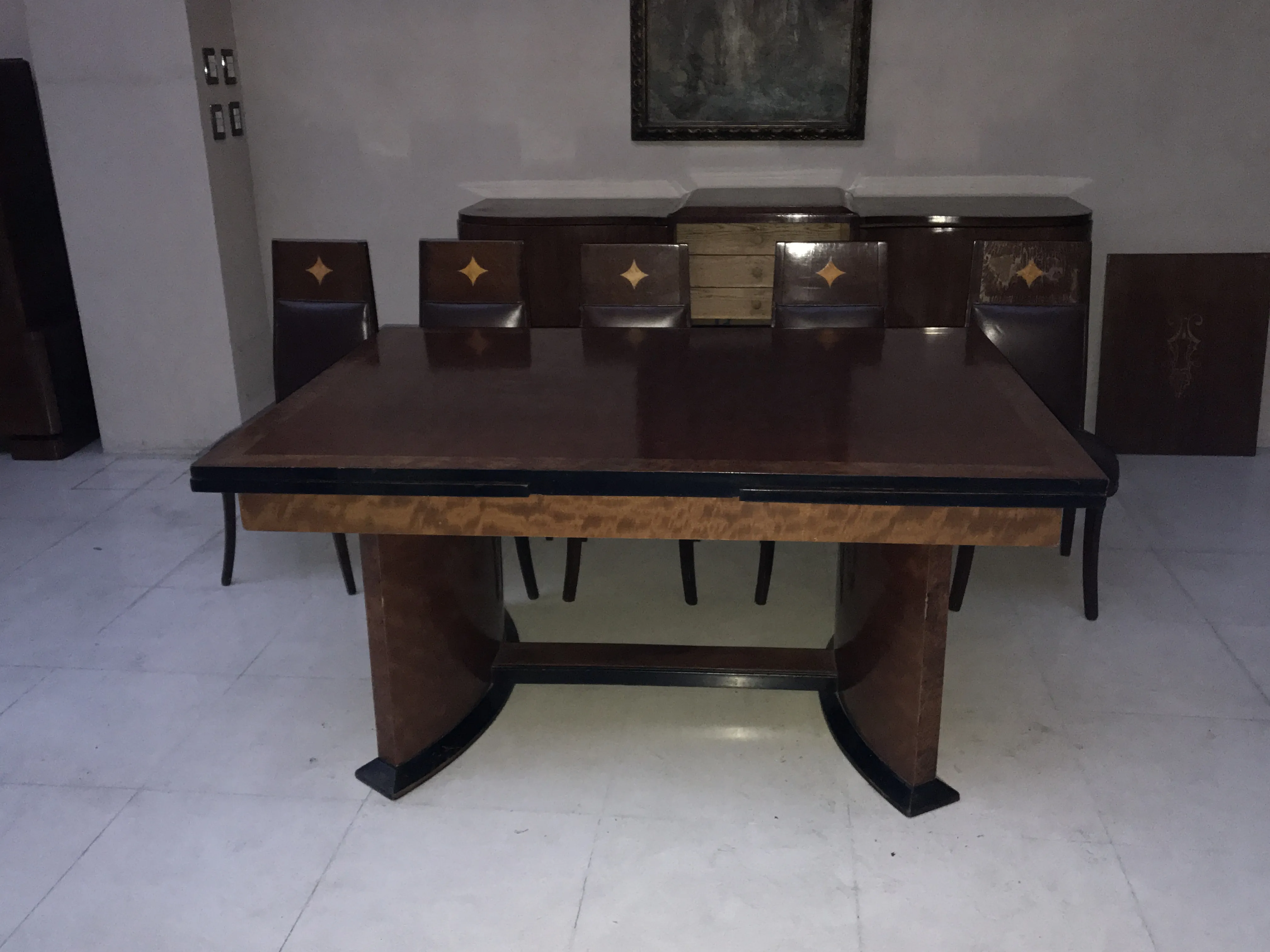 Antique dining table for 12 in a sophisticated setting.