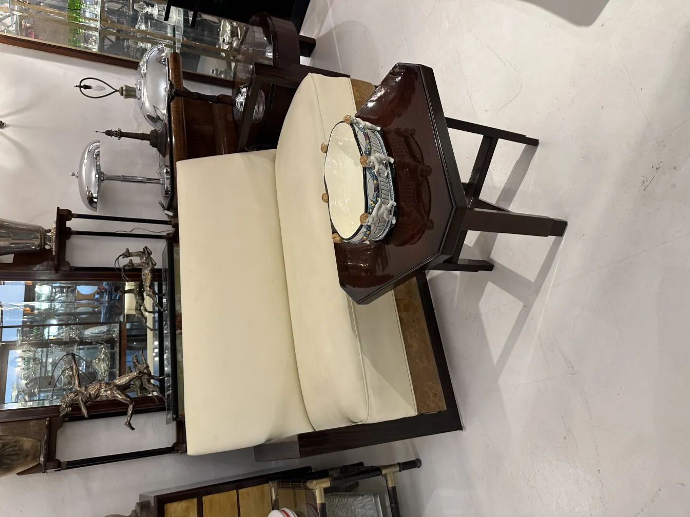 antique sofa with decorative ceramic and table