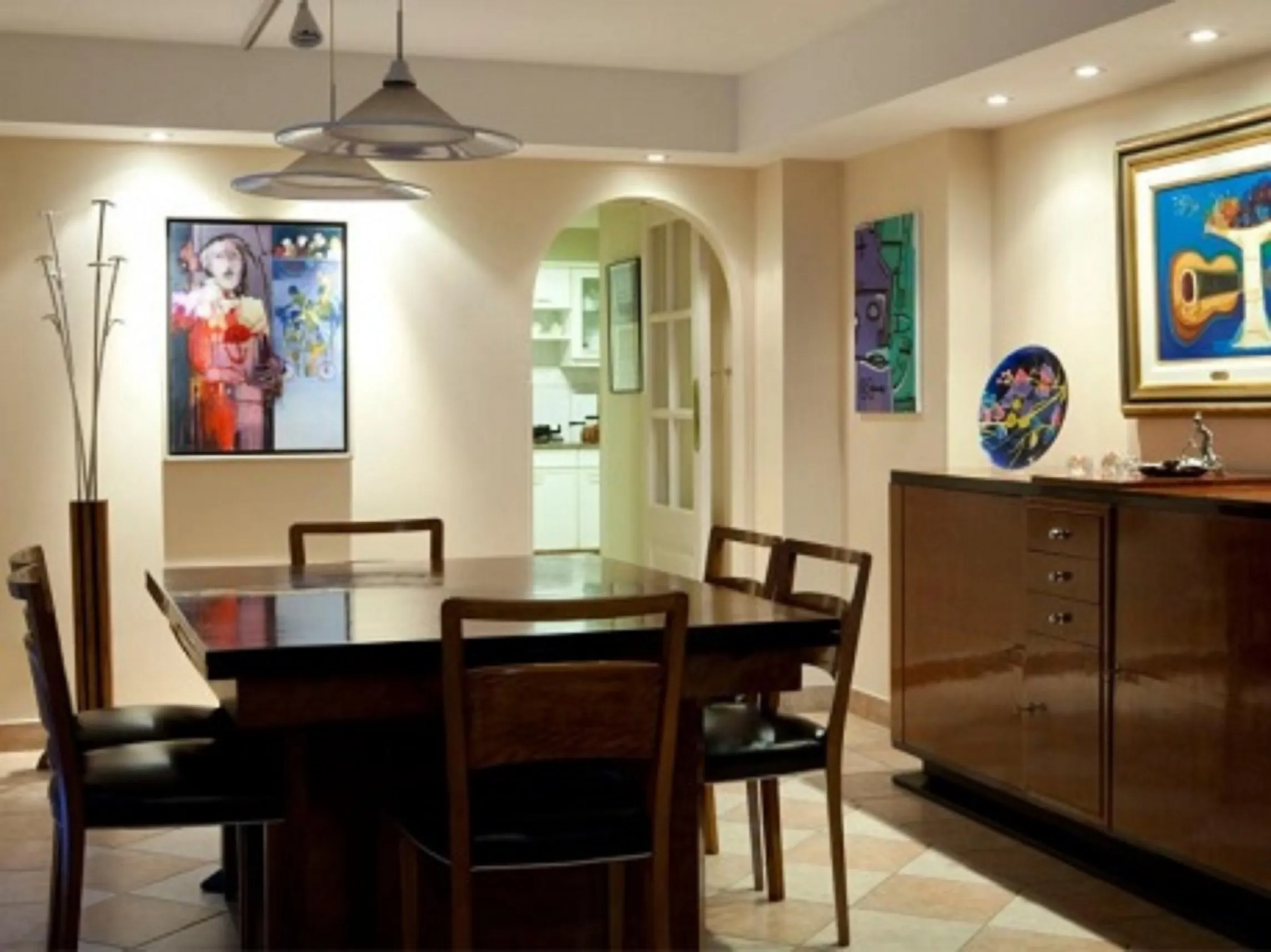 Antique dining table for 12 people in an artistic setting.