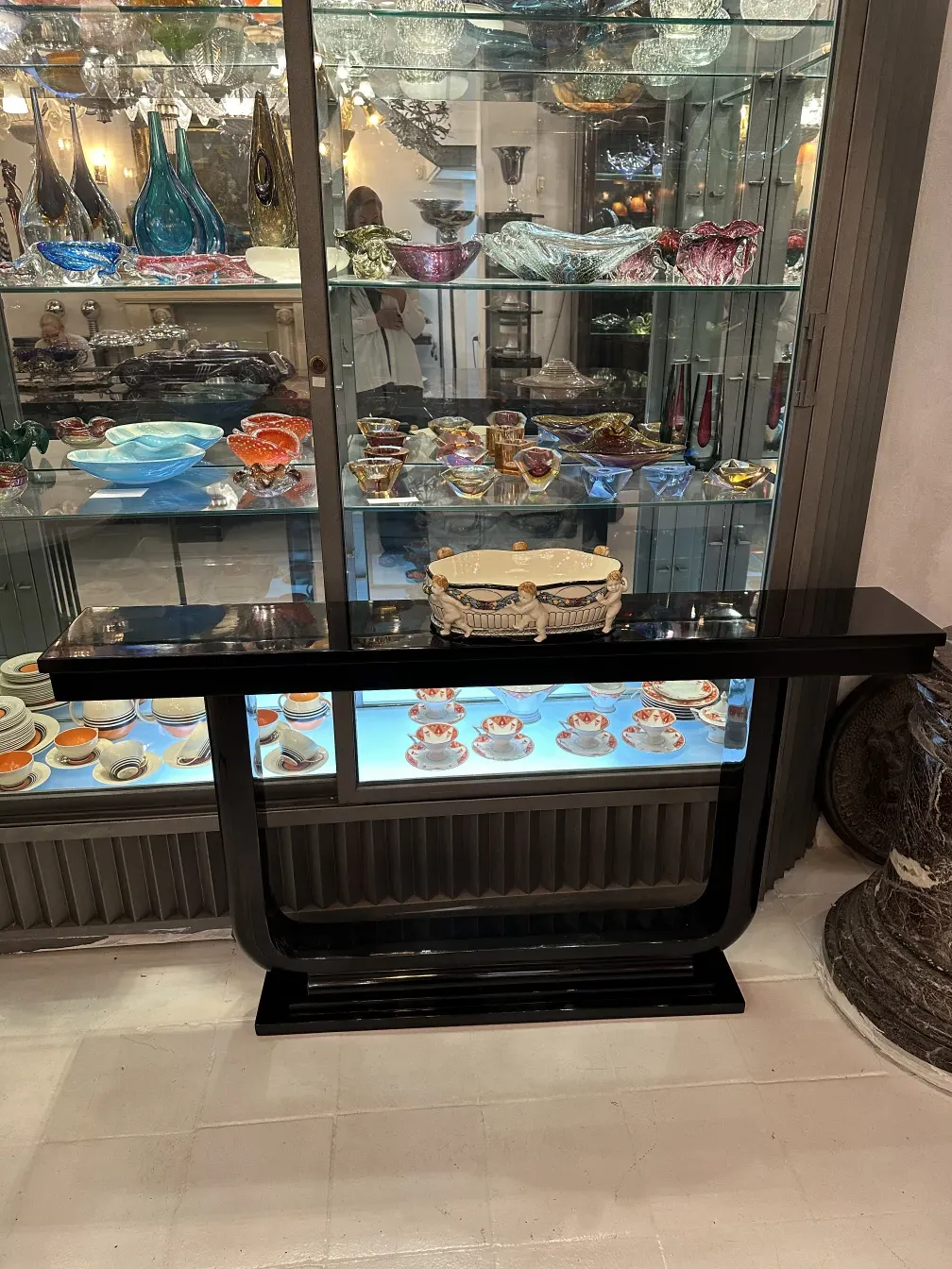 Antique ceramic piece with distinctive design from Karlsruher Majolika Manufaktur, displayed among other antiques.