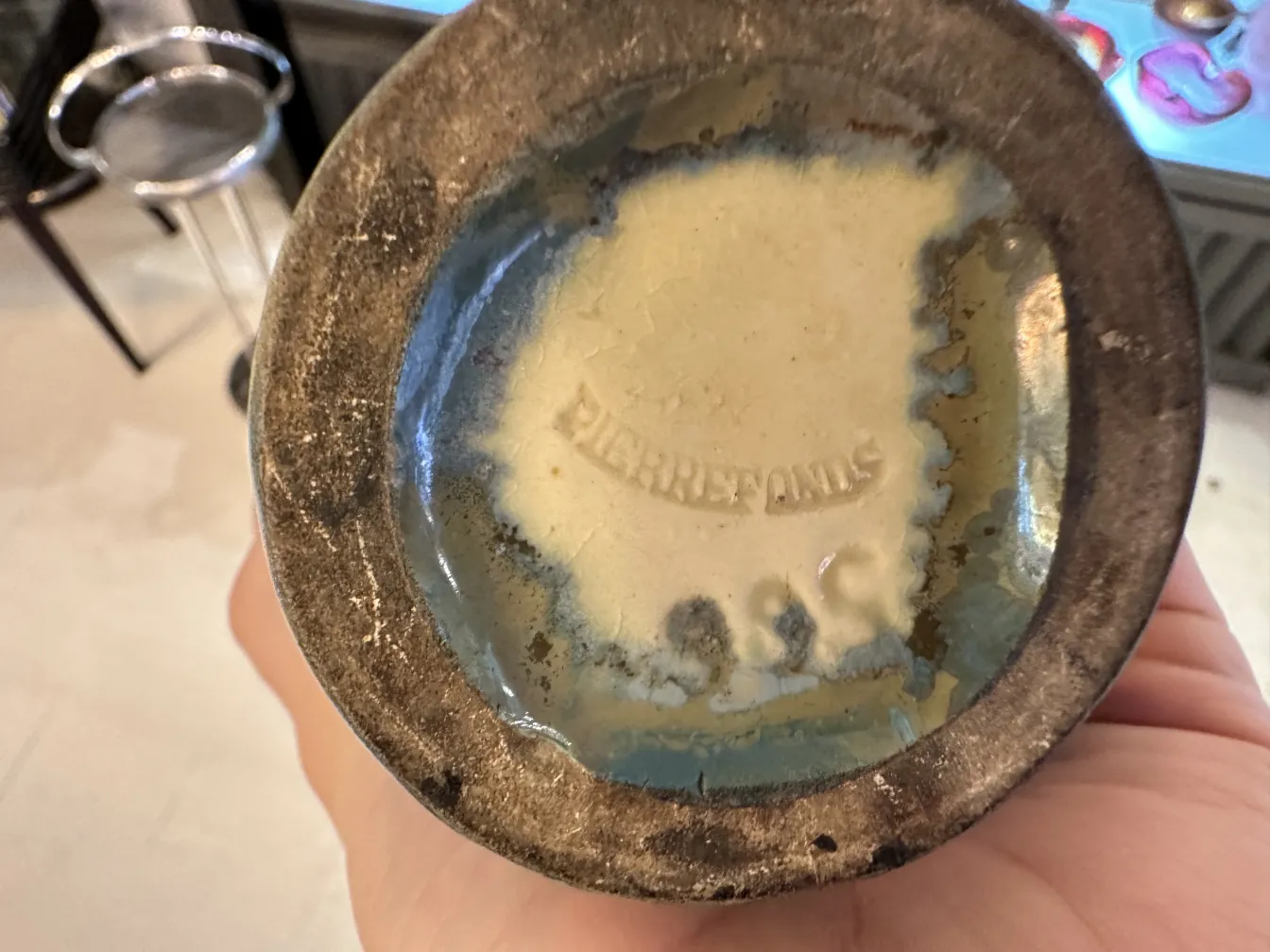 underside of an antique ceramic piece with a stamp
