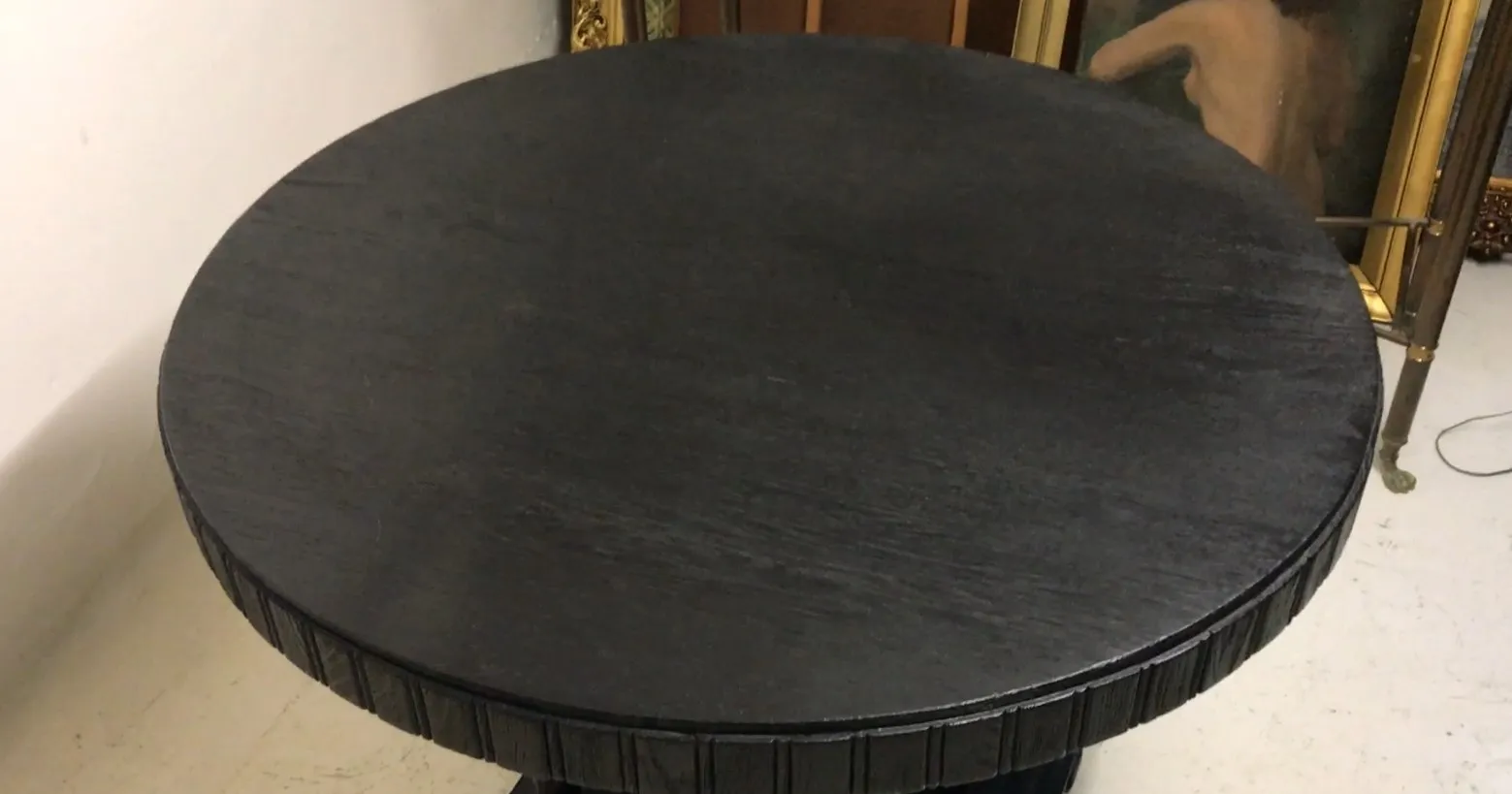 Round antique table for two people, featuring an elegant design.