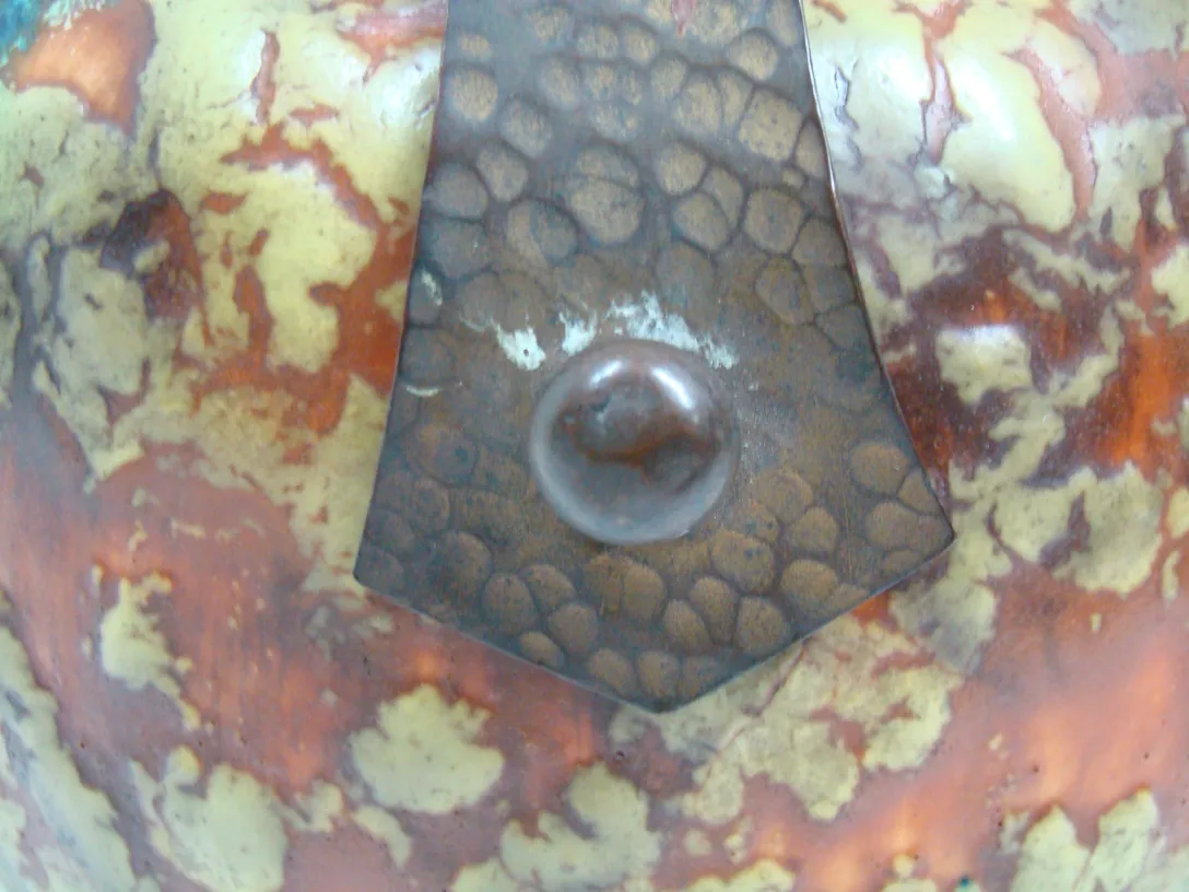 Multicolor antique ceramic with skin-like details.