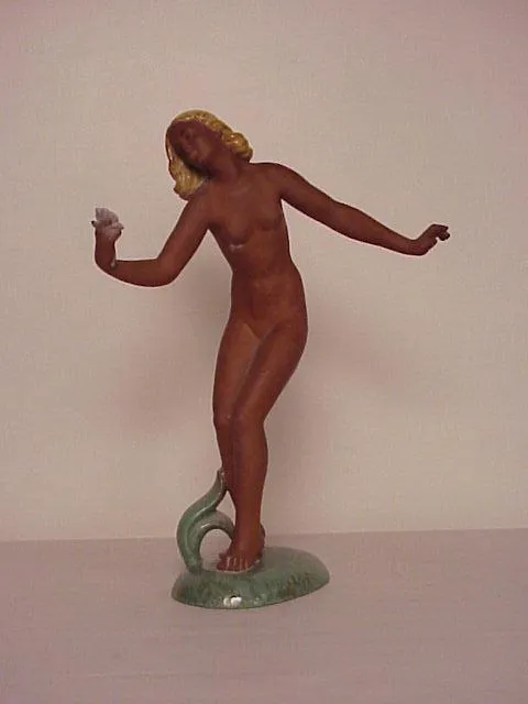 Antique ceramic sculpture depicting a female figure in motion