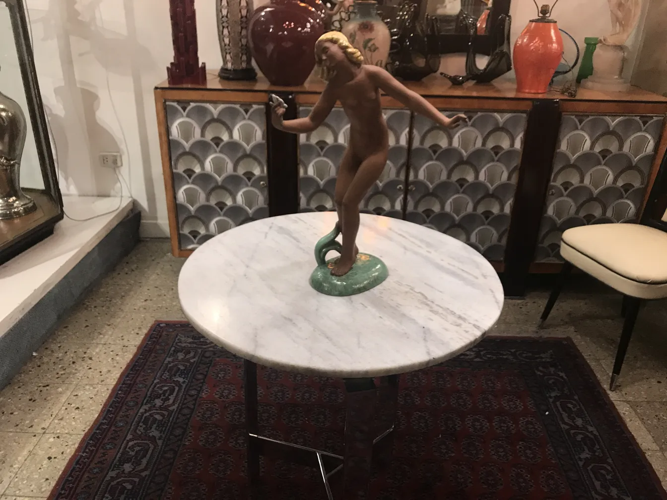antique decorative ceramic with figure on round table