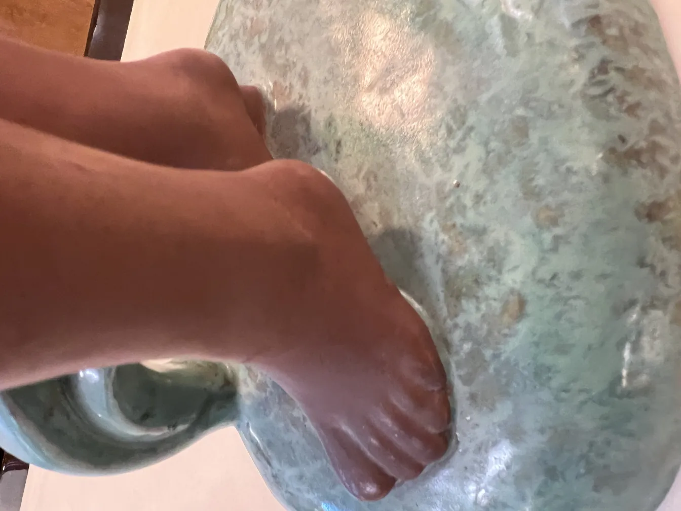 sculpture of antique ceramic with foot details